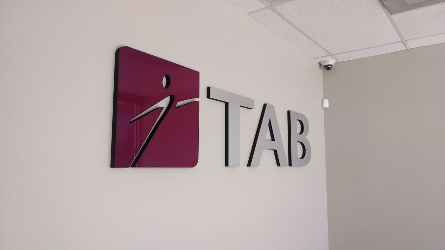 TAB Interior Lobby sign